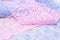 Abstract background, texture of lace ribbons. blue and pink colors. atelier