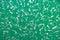 Abstract background. Texture of a painted green concrece wall with pilled paint on it. Wall with abstract pattern