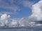 Abstract background texture of white clouds and blue sky. Thick cumulus clouds. Copy space