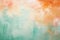 Abstract background with textured gradient soft pastel orange and green with distressed paint strokes and splatters on