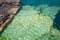 Abstract background view of gorgeous rocks lying underwater of great Cyprus lake
