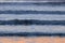 Abstract background of waves on beach in cool color scheme