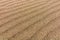 Abstract background of wavy sand dunes. Pattern on the sands.