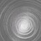 Abstract background A whirlwind of twisted spiral metal lines Spiral contour whirlpool twist on a gray background Abstract cyclic