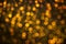 Abstract backgroung of golden glitter and glow soft bokeh shining light. Dreamy sparkle background