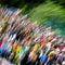 Abstract beautiful vivid colorful background. This greatly blurred crowd unrecognizable young people at concert, summer