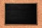 Abstract blackboard or chalkboard with frame on wooden background