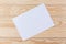 Abstract Blank one white paper on wooden table top view background concept for empty letter business sheet, plain brochure mock up