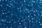 Abstract blue background. Shiny glitter bokeh in blue colors. Classic blue