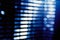 Abstract blue blur of city lighting digital lens flare glare, blinds light background