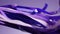 Abstract blue purple violet silk ribbons waving. Fashion background. Cut torn tape ribbon wave cloth satin color fabric