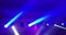 Abstract blue and violet purple, bright shiny stage lights flashing movement entertainment spotlight projectors in the dark