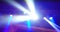 Abstract blue and violet purple, bright shiny stage lights flashing movement entertainment spotlight projectors in the dark