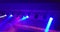 Abstract blue and violet purple, bright shiny stage lights flashing movement entertainment spotlight projectors in the dark