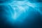 Abstract blue water background with sunbeams