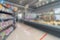 Abstract blur and defocus shopping mall in department store interior for background. Walls of the shop modern vintage