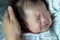 Abstract blur image of Asian Chinese New born child tired and hungry