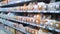 Abstract blur image of supermarket background. Defocused shelves with food. Grocery shopping. Store. Retail place. Rack. Discount