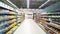 Abstract blur image of supermarket background. Defocused shelves with fresh products. Grocery shopping. Store. Retail industry.