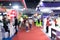 Abstract blur people in exhibition hall event trade show expo background. Business convention show, job fair, or stock market.