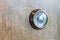 Abstract blur photo of old lens peephole on wooden door background.
