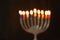 abstract blurred background of jewish holiday Hanukkah background with menorah (traditional candelabra) Burning candles