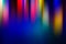 Abstract blurred background multicolored light rays elongated vertically