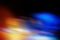 Abstract blurred color blurred dark background, orange, cyan, black and light spots