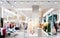 Abstract blurred of fashion clothes shop boutique interior in shopping mall, with bokeh light background. Blurred image of
