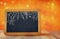 Abstract blurred glitter background and empty blackboard