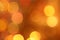 Abstract blurred golden circular bokeh lights