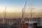 Abstract blurred harbor situation in Lubeck with boats and cranes in the evening sun, long term and double exposure with vertical