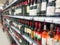 Abstract blurred image. Defocused lens. Wine, cognac and other alcoholic beverages on the shelves in the supermarket