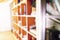 Abstract blurred modern white bookshelves with books. Blur manuals and textbooks on bookshelves in library or in book store. Conce