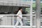 Abstract blurred motion of young Asian business woman running to work