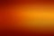 Abstract blurred orange gradient background with space for text or design