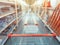 Abstract blurred photo of hardware store with empty shopping car