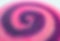 Abstract blurred pink and purple colored spiral pattern of a yummy candy