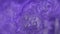 Abstract blurred shining background with sequins. The texture of purple of mother-of-pearl water with bubbles Bath salts