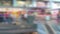 Abstract Blurred Shoppers using a down escalator
