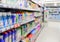 Abstract blurred supermarket shelves with colorful goods