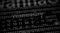 Abstract blurred Tech Digital Data Transfer Numerical continuous code in green colorwith red WannaCry words web data in binary