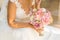 Abstract blurring of a bride with a bouquet