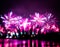Abstract, blurry, bokeh-style colorful photo of fireworks in a purple tone
