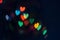 Abstract blurry defocused bokeh image in the shape of a heart. Noise is visible in the image