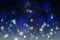 Abstract blurry illustration on a blue background in the form of a starry sky with flying snowflakes, festive winter Wallpaper