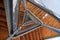 An abstract bottom view of a wooden staircase leading to the top of the tower. Triangle