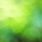 Abstract bright background of a bokeh of different shades of green, photo, square