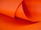 Abstract bright orange paper background for your design. Three-dimensional geometric image. Selected sharpness