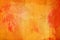 The abstract bright orange surface has a brush painted on the background for graphic design.